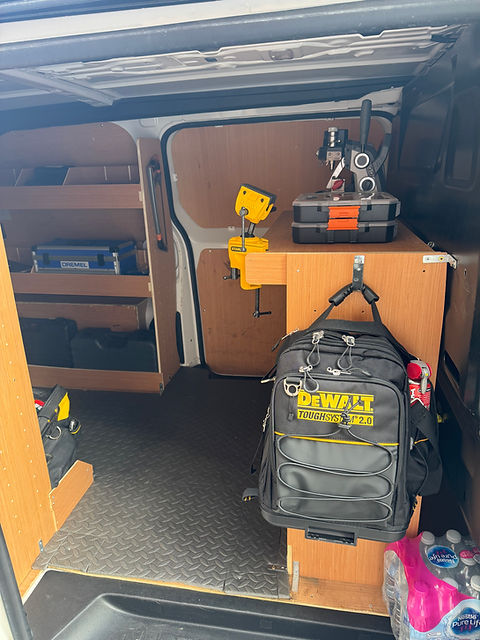 Close-up view of a locksmith’s tools and keys on a workbench